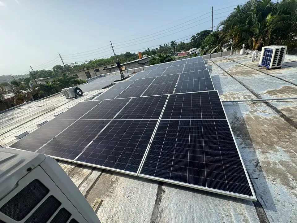 Solar panel system installed on a flat concrete roof in Puerto Rico
