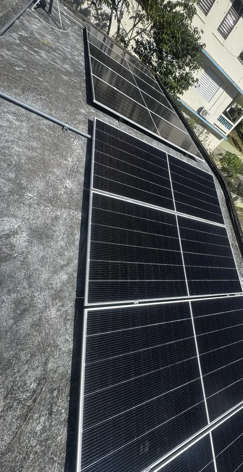 Solar panels on the roof of a house in a Puerto Rico neighborhood